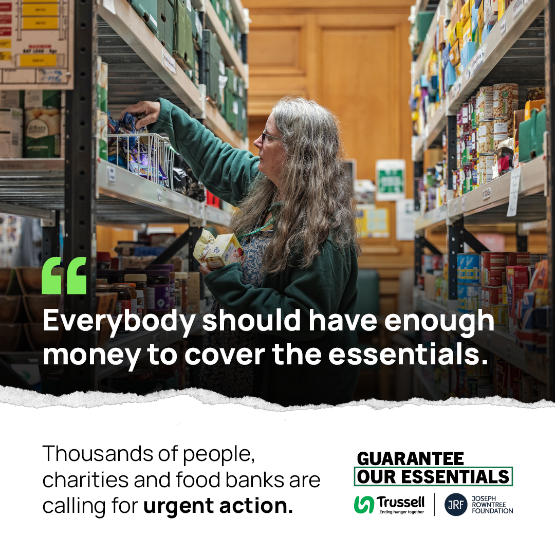 A social post which shows a woman sorting through shelves at a food bank. She is wearing a green jacket. Over the top of the image there is text that reads 'Everyone should have enough money to cover the essentials'