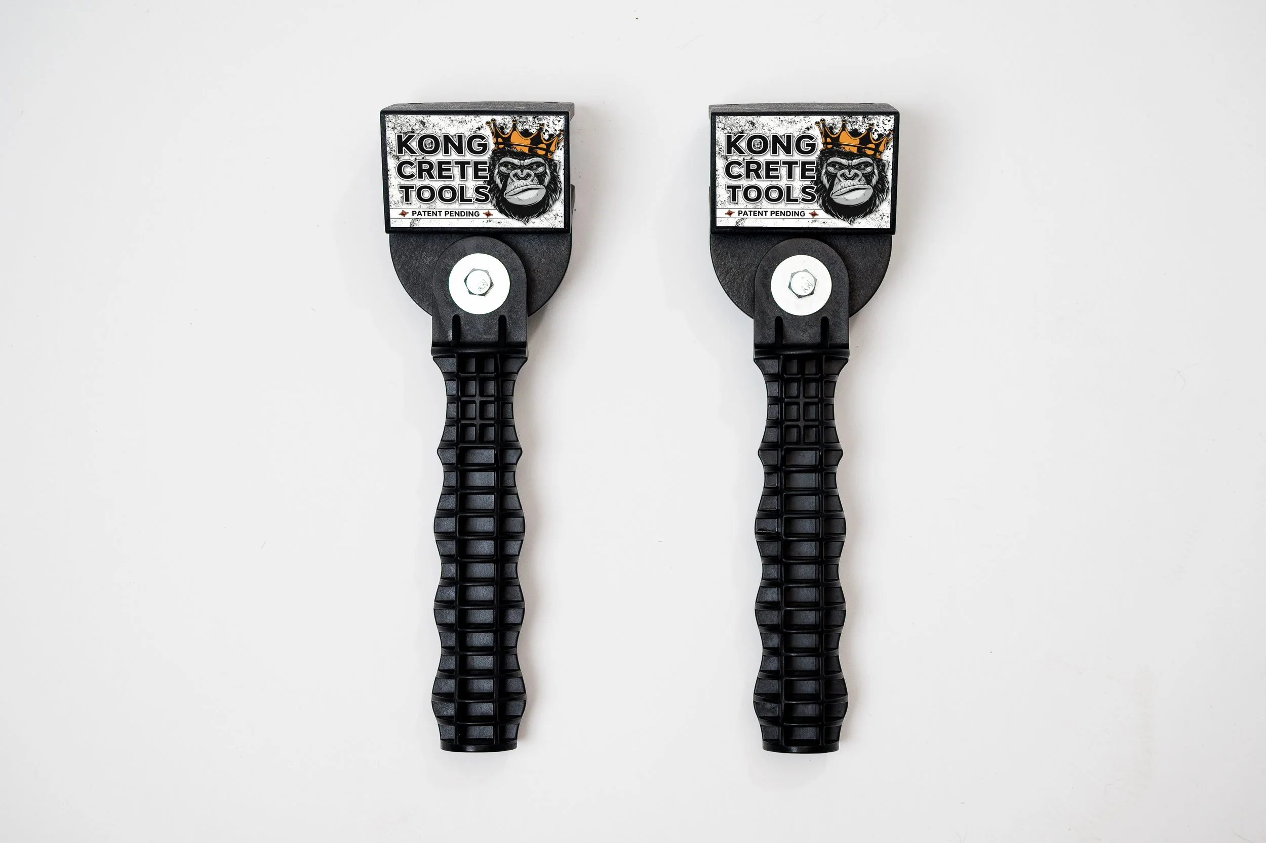 Two black rubber tie-down straps with adjustable ratchet mechanisms against a white background.