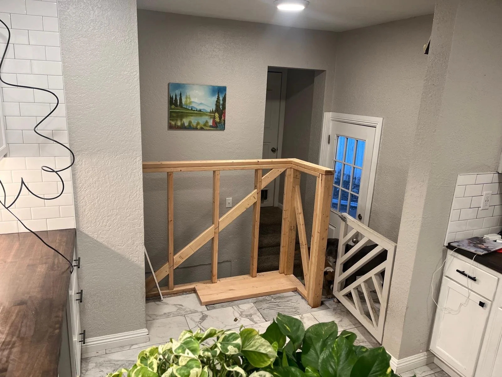 REPLACED RAILING WITH A FRAMED HALF WALL (PART OF THE PROCESS)