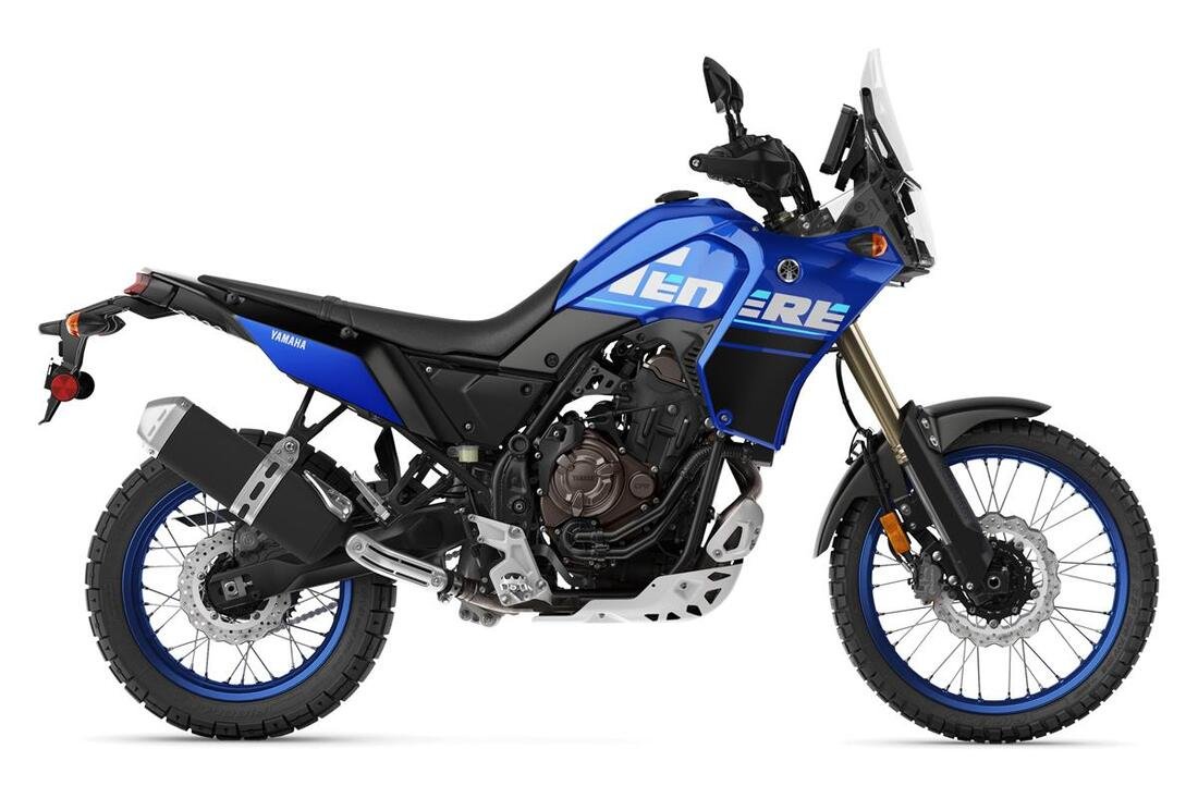 A blue Yamaha adventure motorcycle with black and white accents, a tall windscreen, knobby tires, and a large exhaust system.