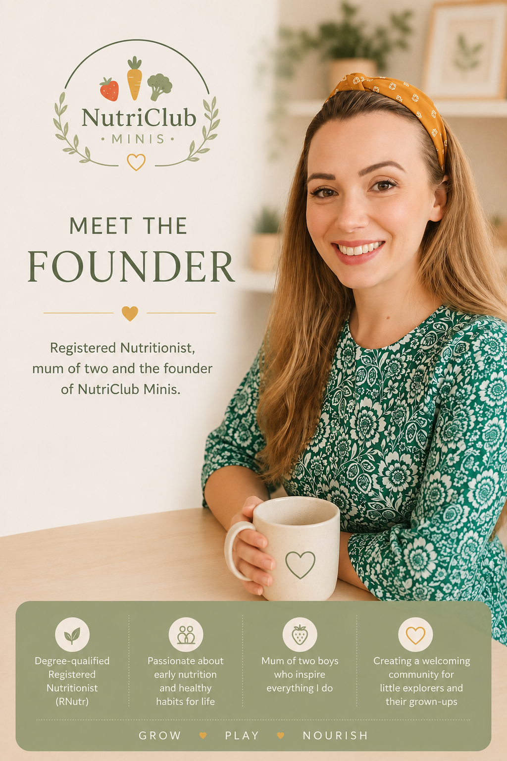 A woman with long, wavy blonde hair, wearing a green patterned dress and a yellow headband, smiling while holding a mug with a heart symbol. Behind her is a blurred indoor background, and she is sitting at a light wood table.
