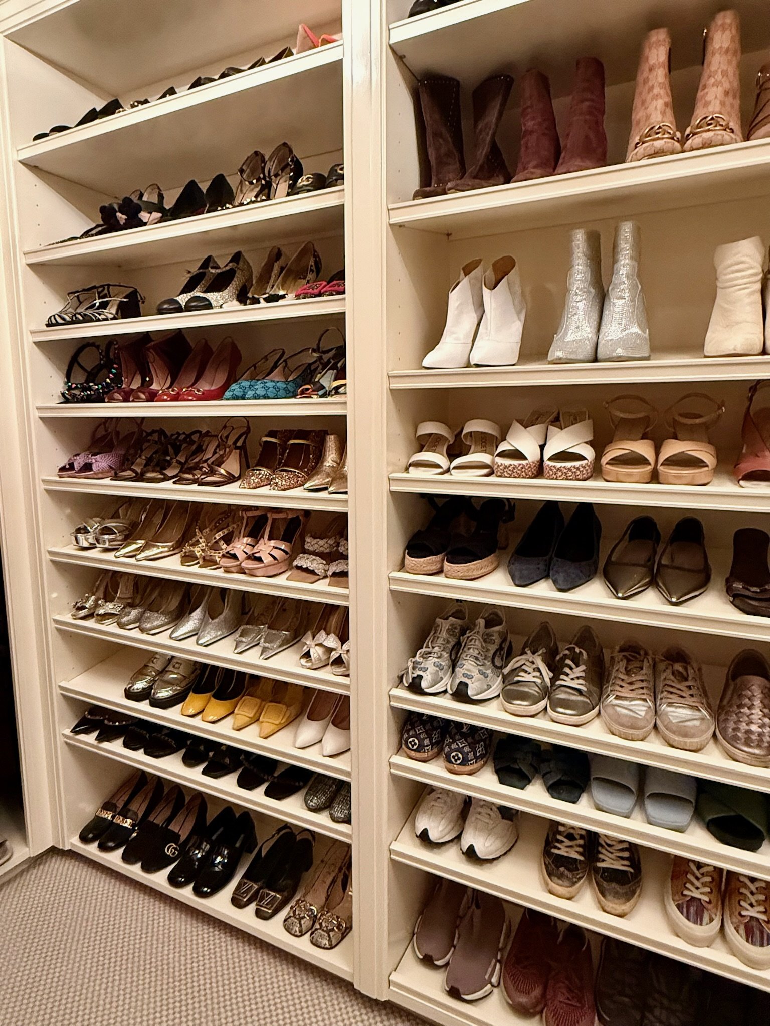 Professionally organized shoe shelving in a walk-in closet