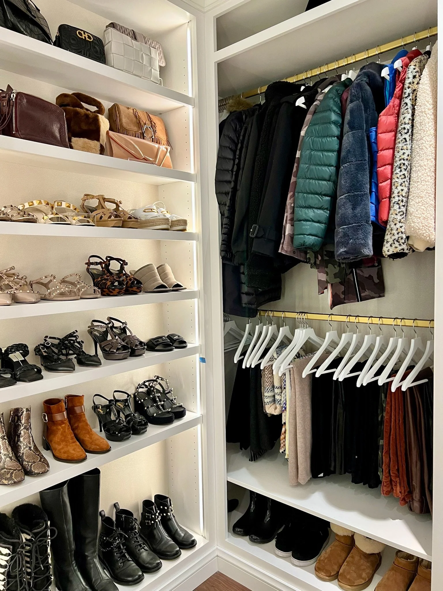 Custom closet with organized shoes and hanging clothing professionally organized