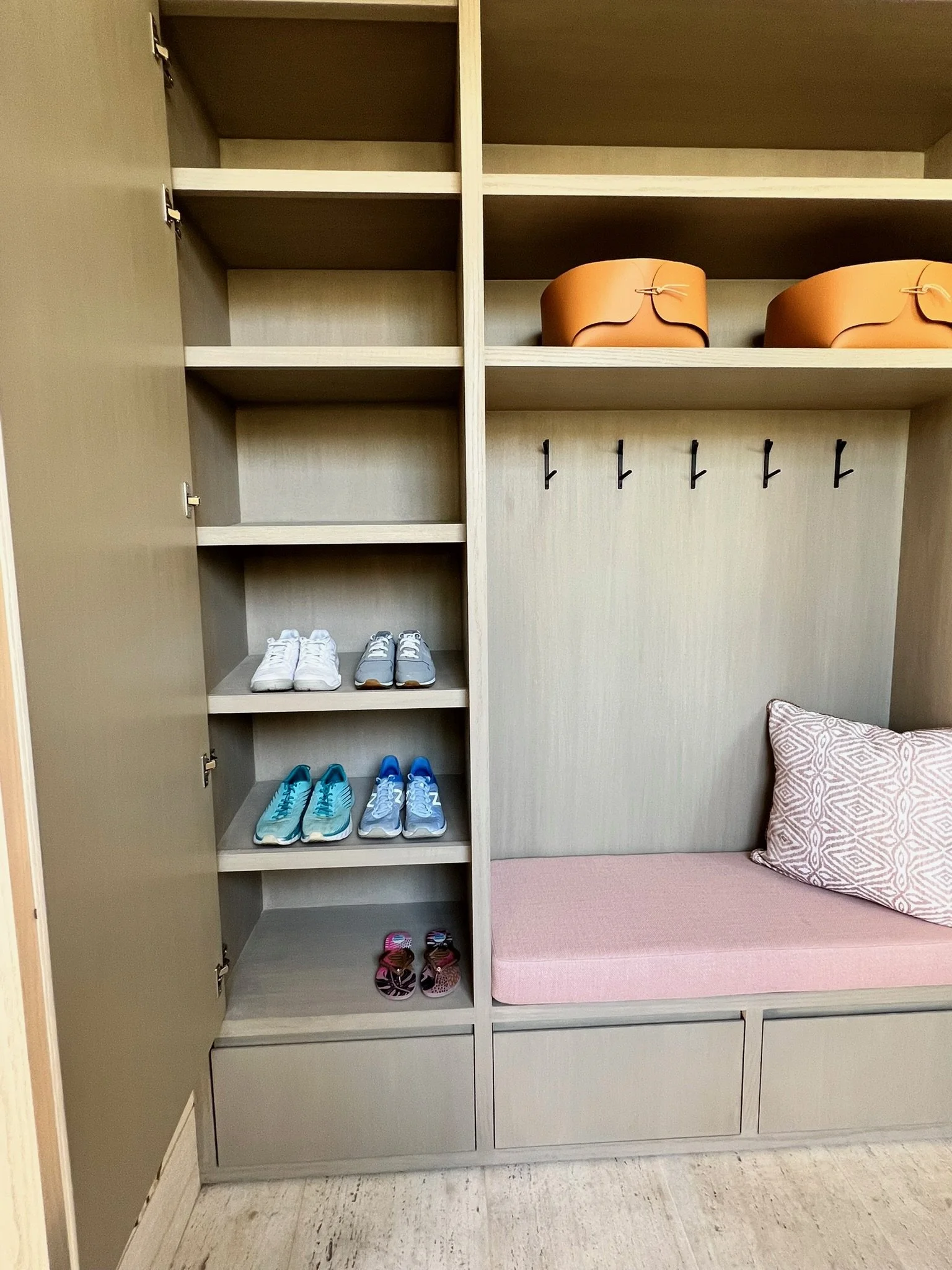 Custom mudroom with cubbies, bench, and shoe storage