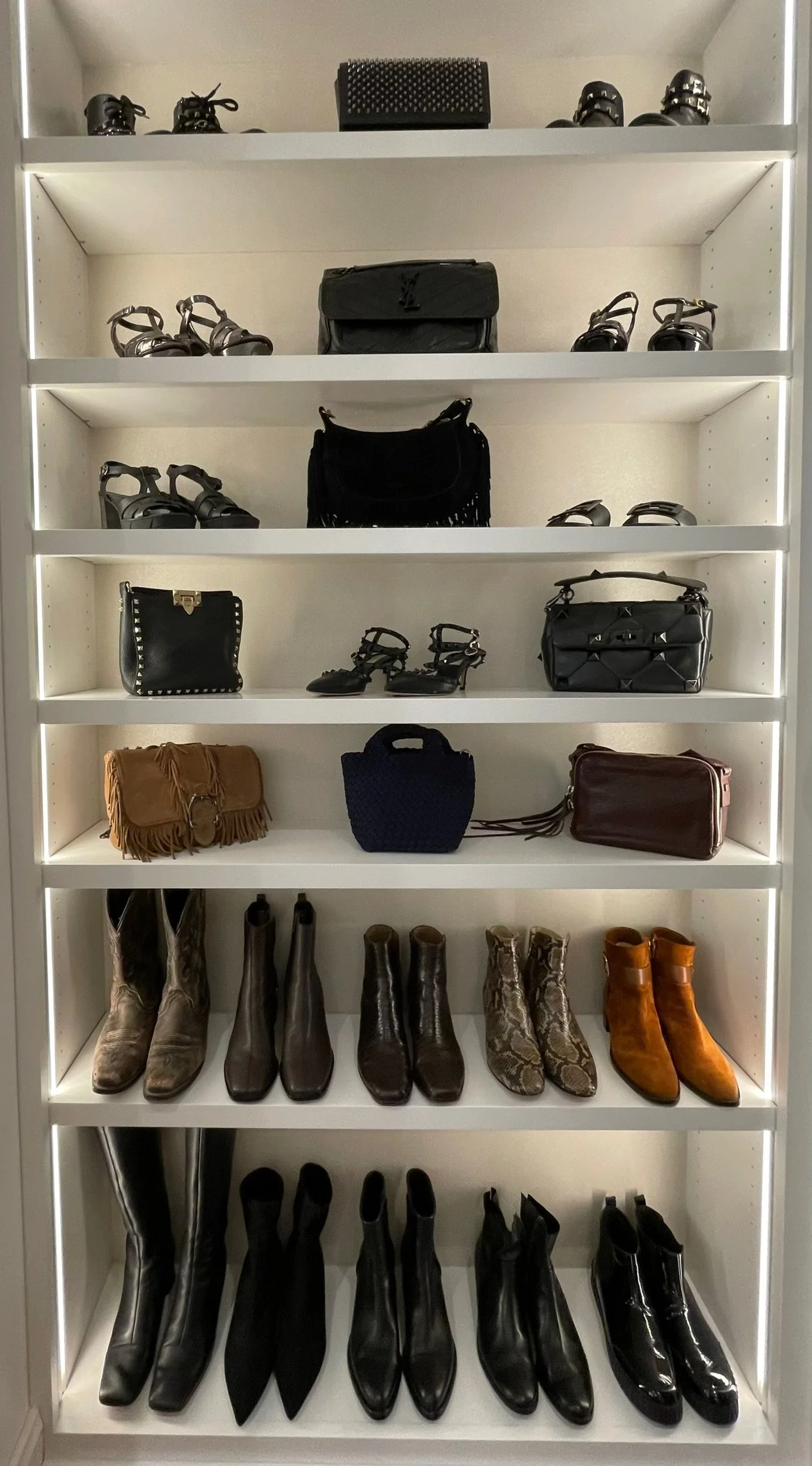Luxury organization in a closet with custom cabinetry