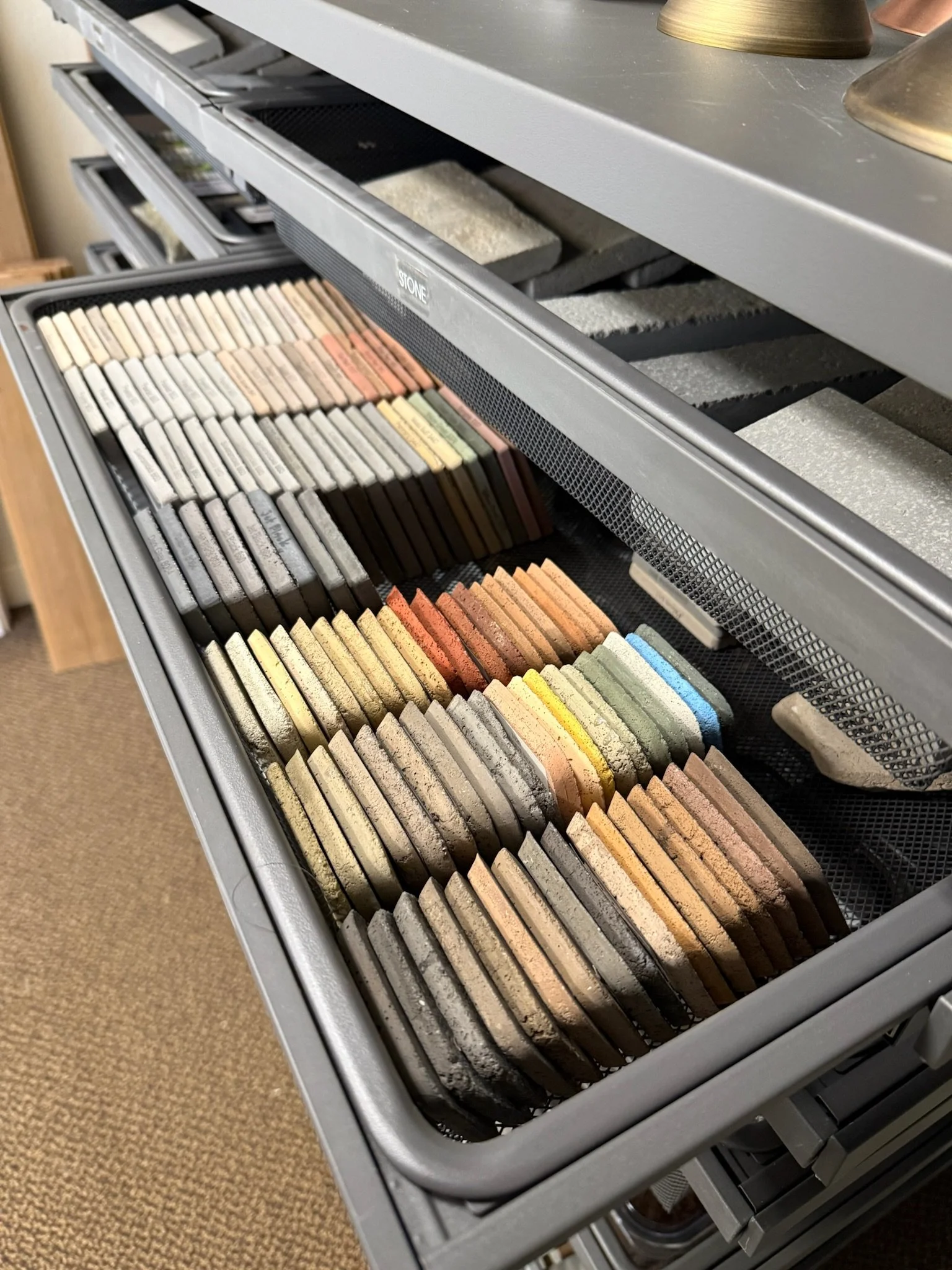 Custom drawer with organized linens and folded textiles