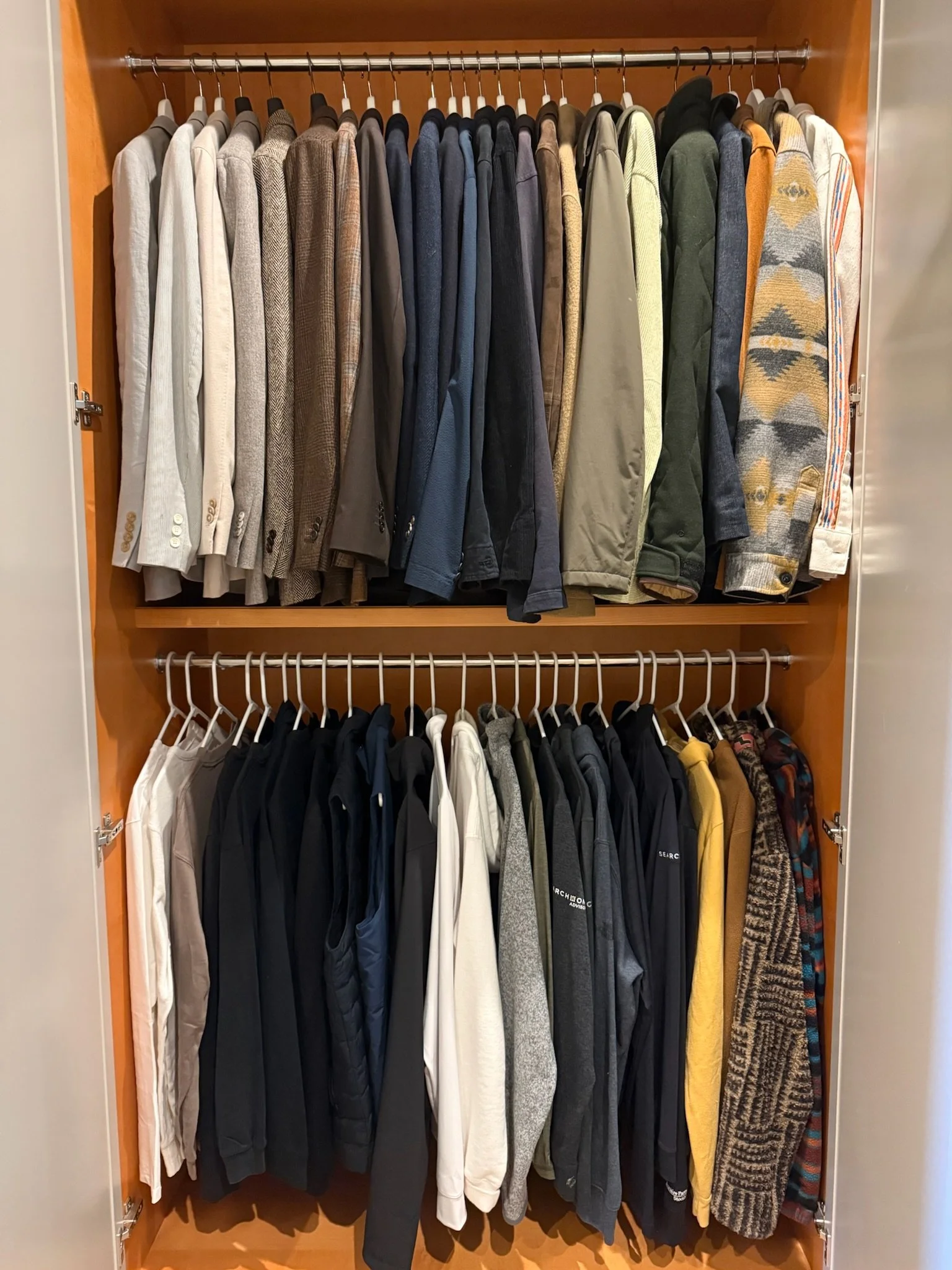 Professionally organized closet with folded and hung clothing