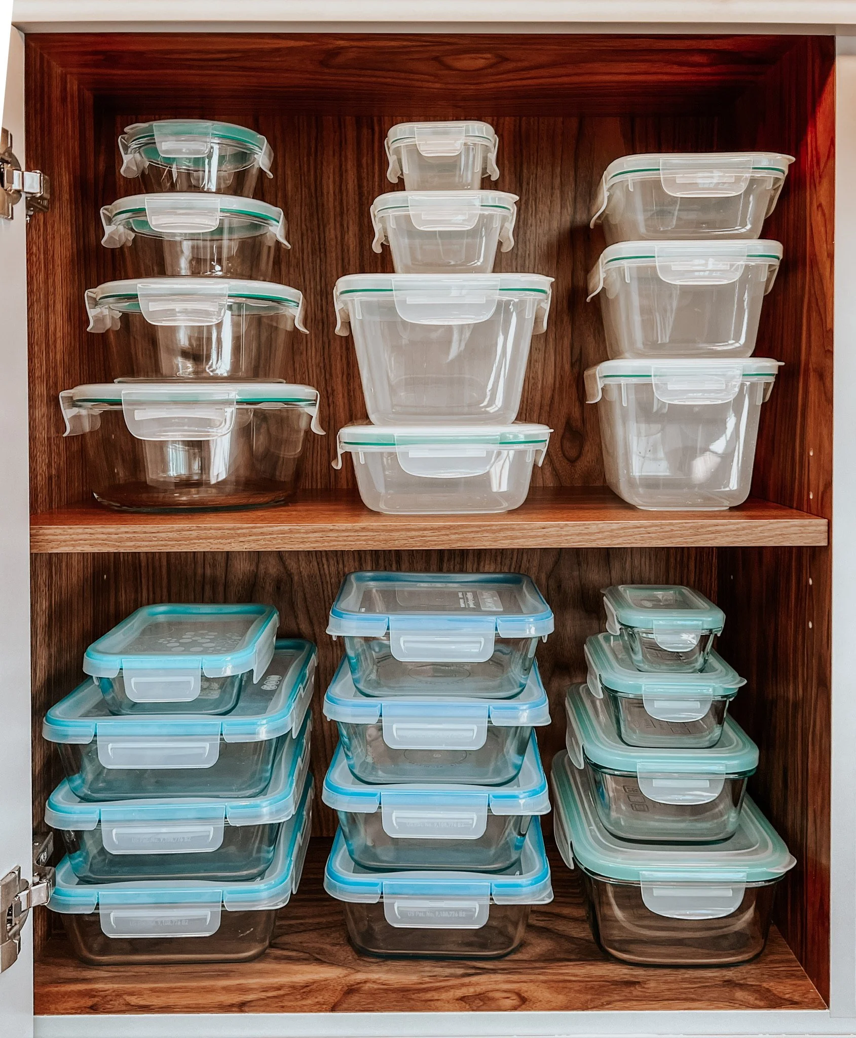 Organized cabinet with neatly stacked food storage containers
