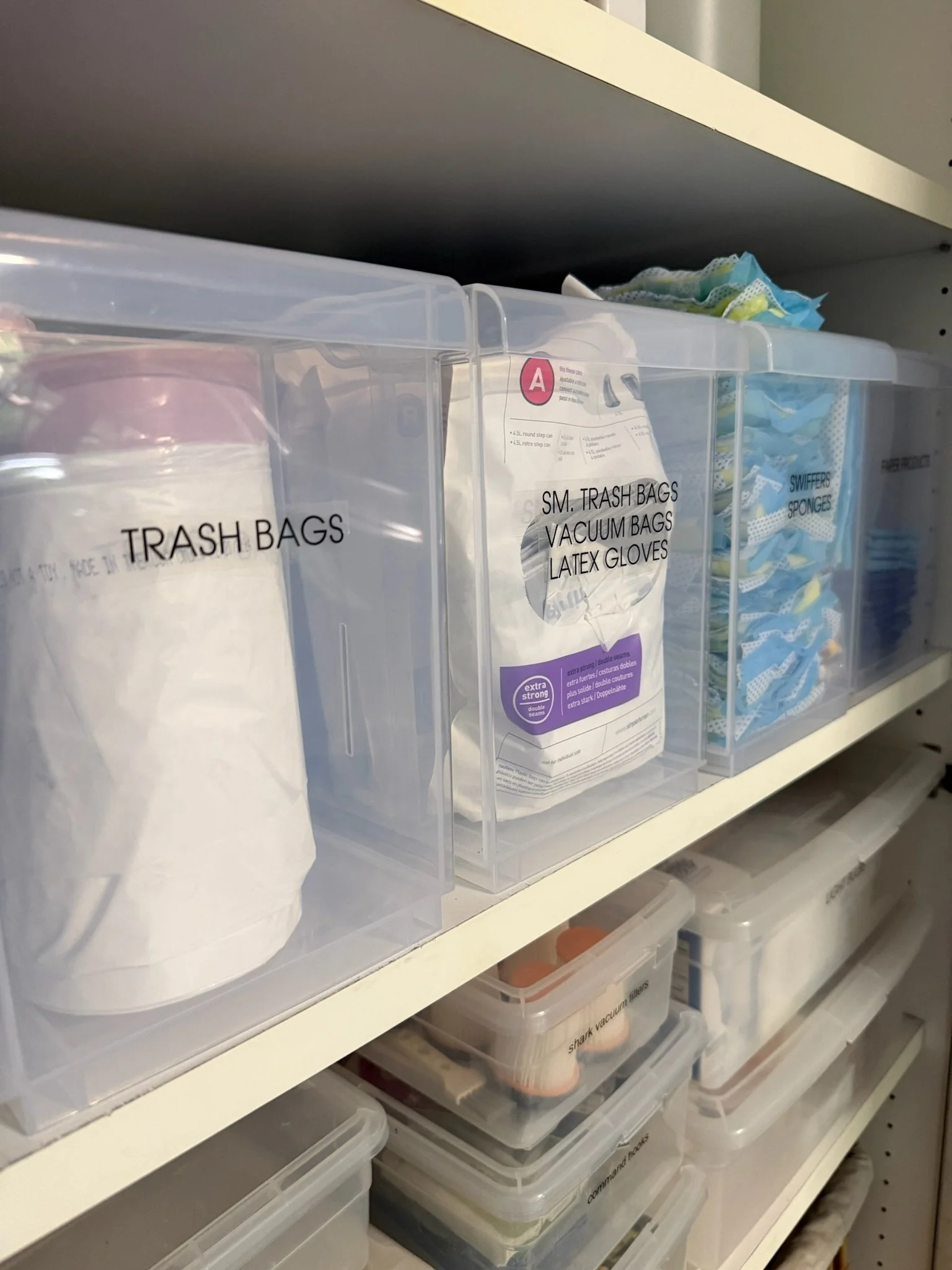 Organized utility shelf with labeled household supplies