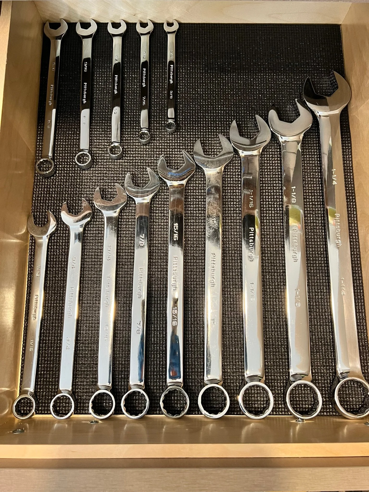 Organized tool drawer with wrenches arranged by size