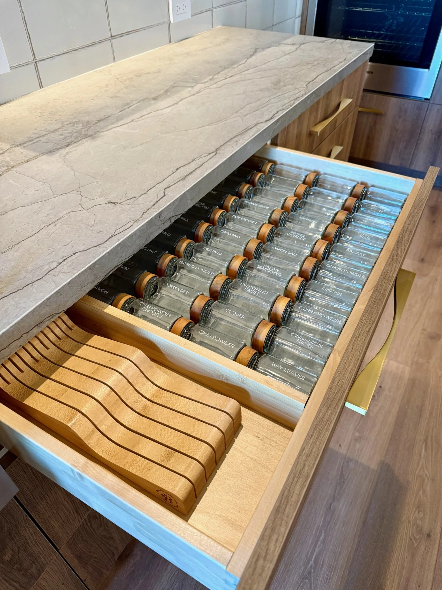 Custom kitchen drawer with dividers and glass spice jars