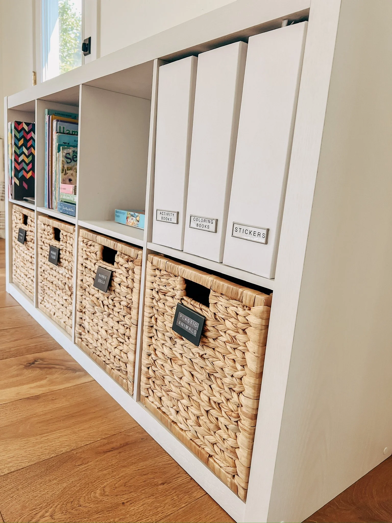 Custom mudroom shelving with labeled woven storage baskets
