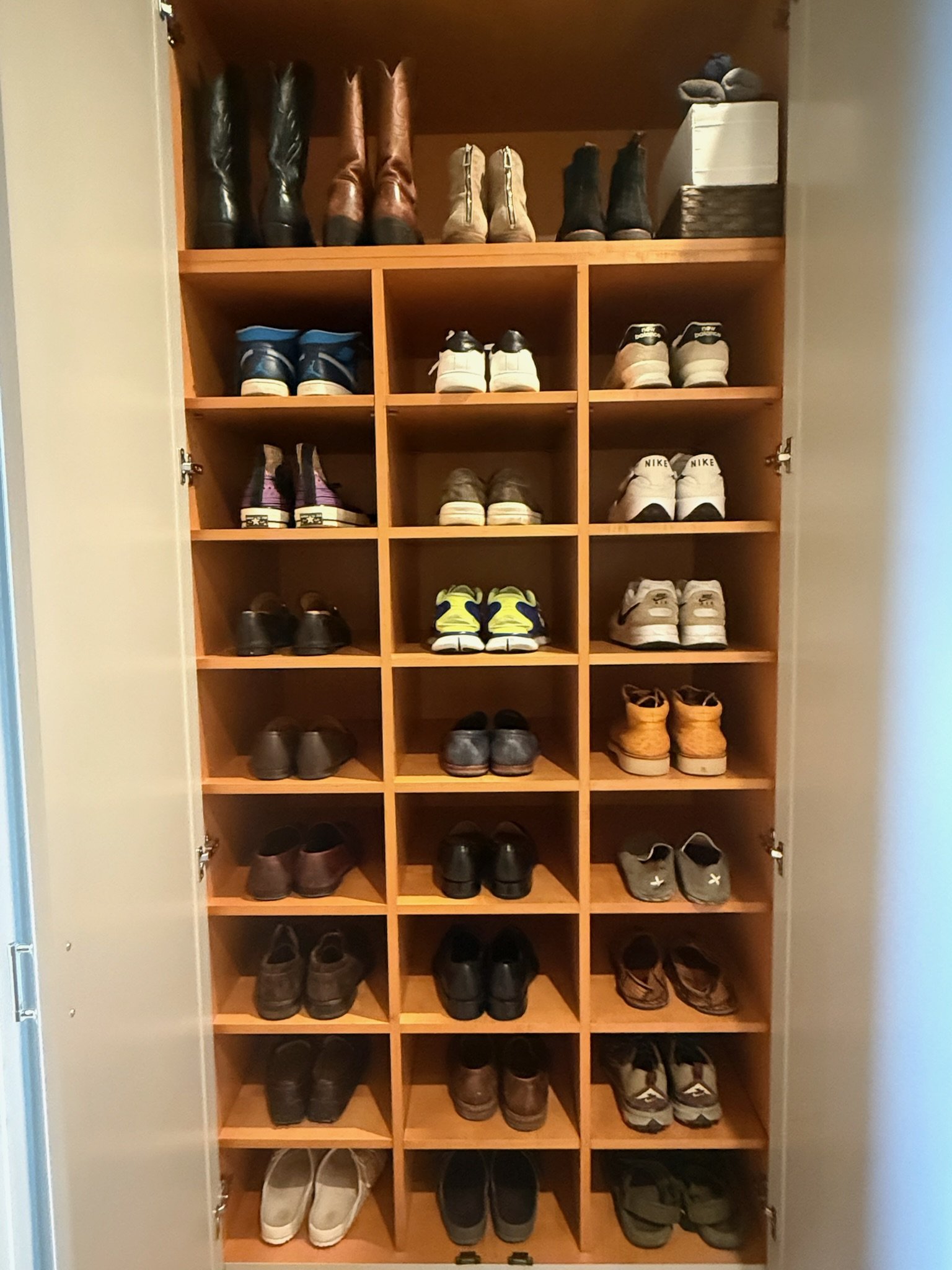 Custom shoe shelving with neatly arranged pairs