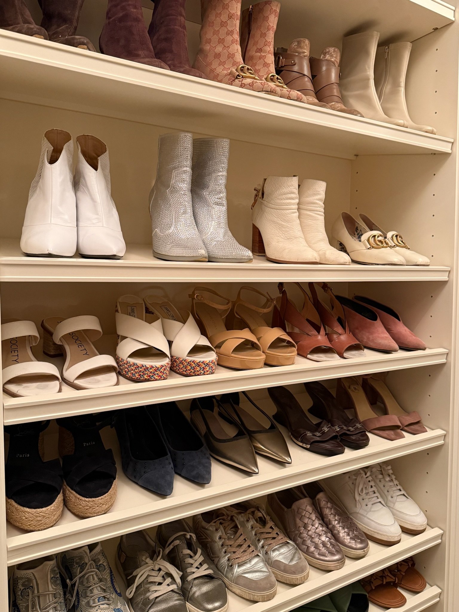 Custom closet shoe shelving, professionally organized