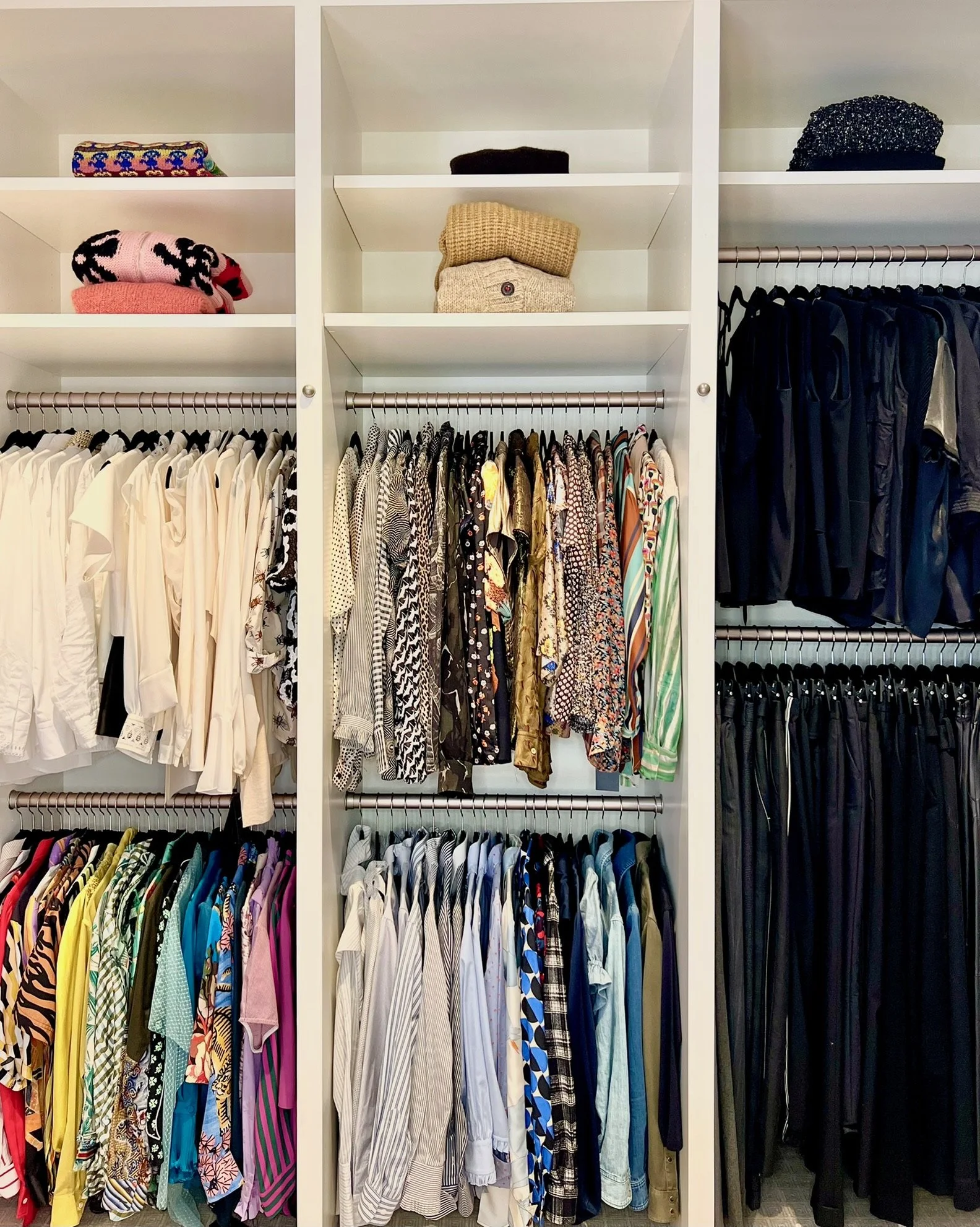 Custom walk-in closet with organized clothing and accessories