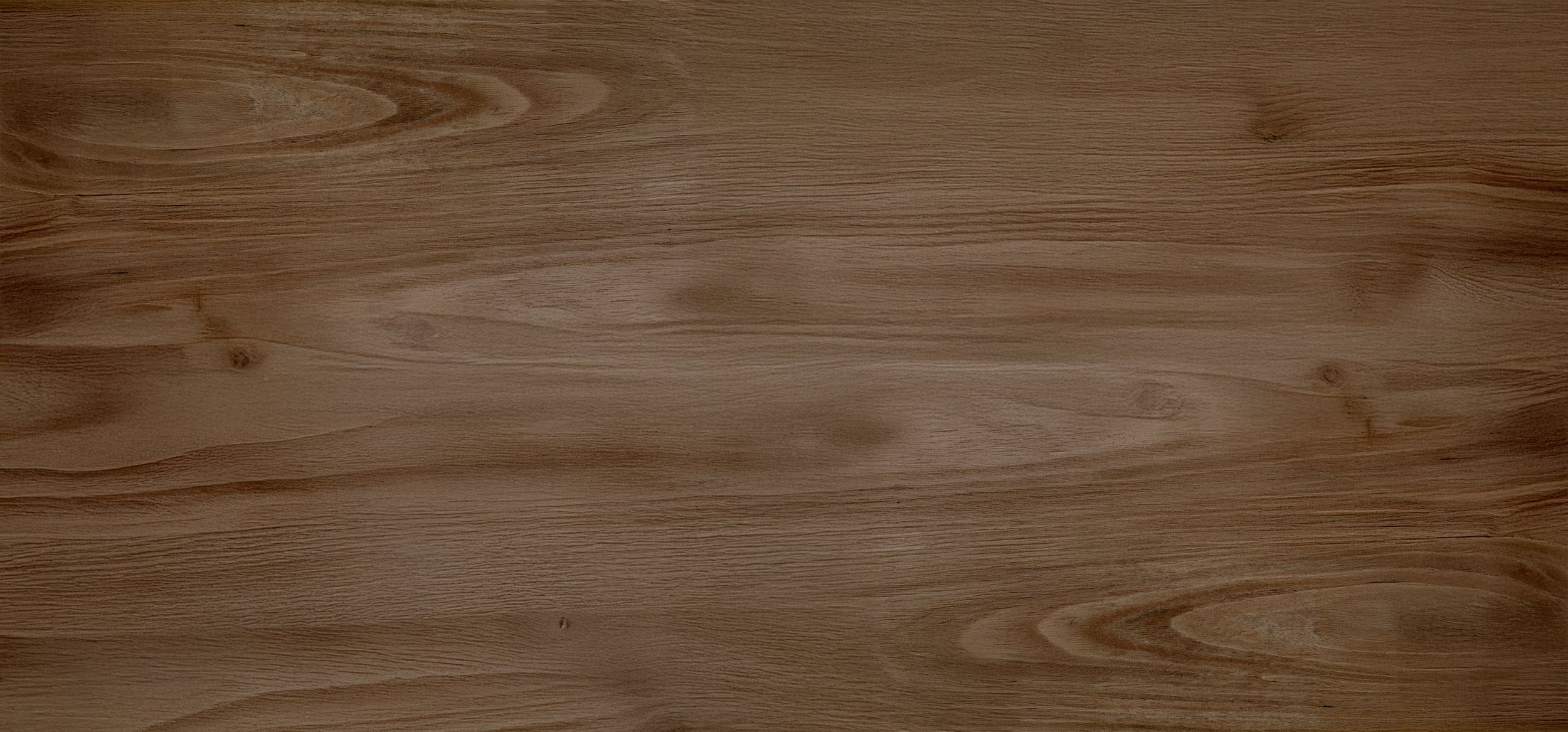 Smooth wooden surface with visible wood grain patterns.