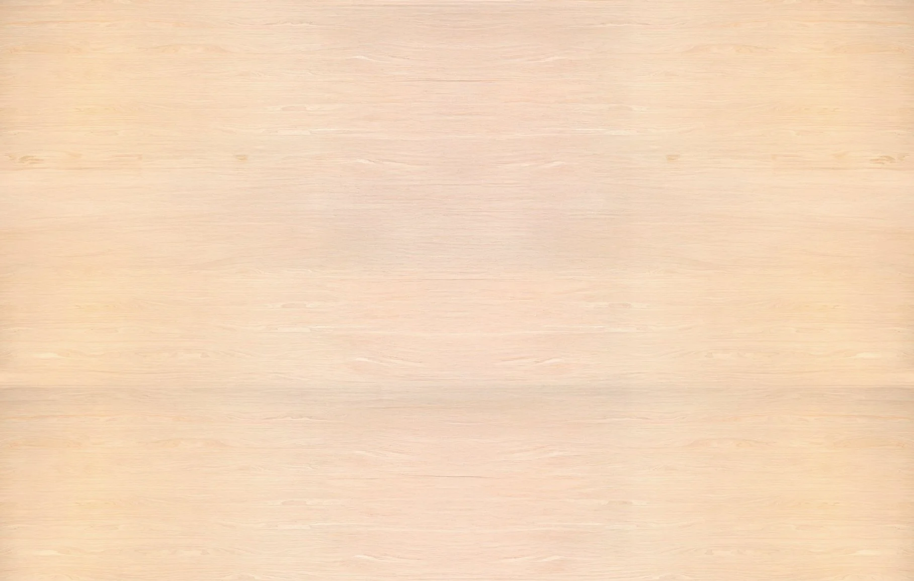 Light-colored wooden surface with a smooth grain pattern.