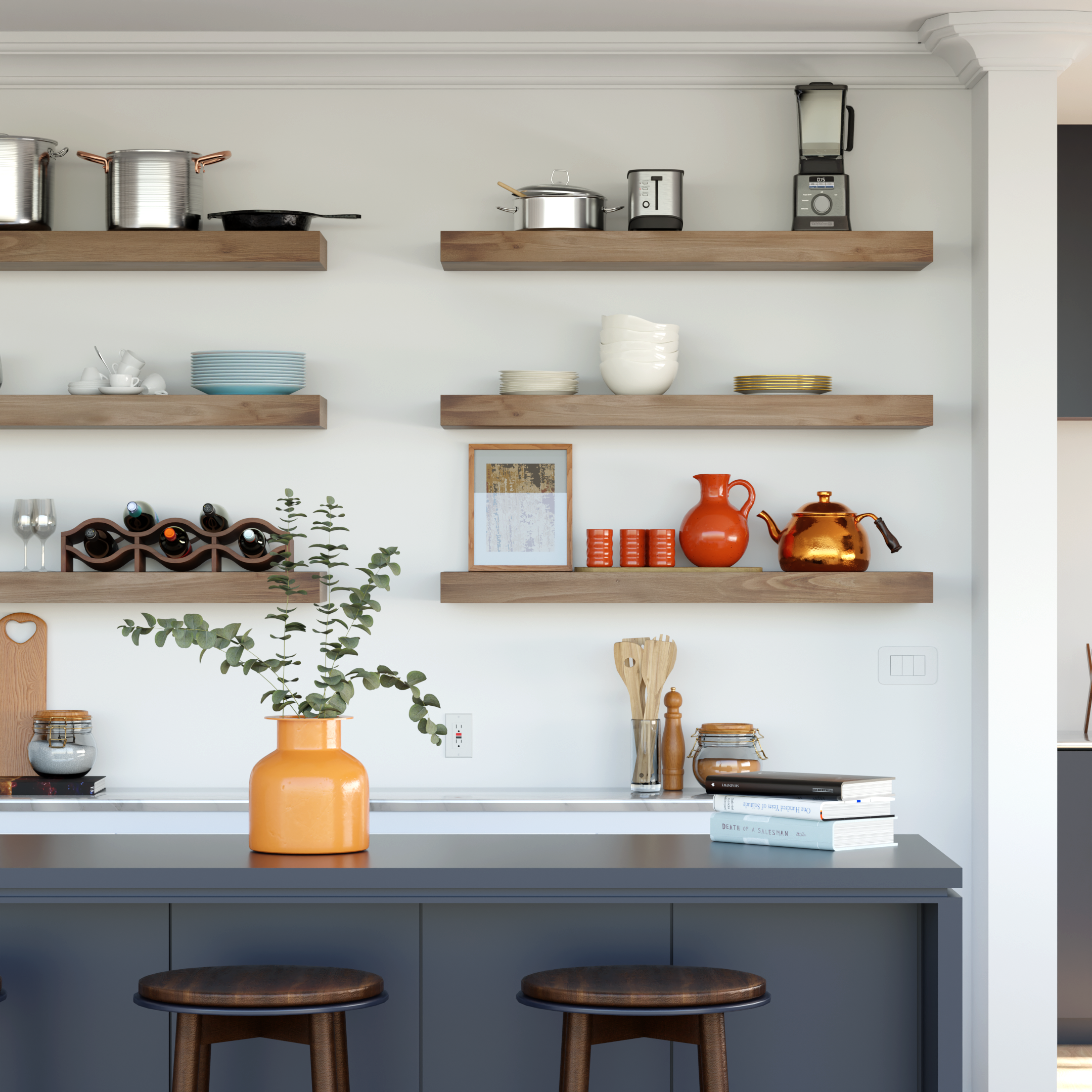 Kitchen with white walls and floating wooden shelves holding cookware, tableware, books, and decorative items, with two wooden stools beneath a gray countertop.