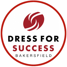 Logo for Dress for Success Bakersfield with a circular red border, stylized red swirl icon, and black and red text.