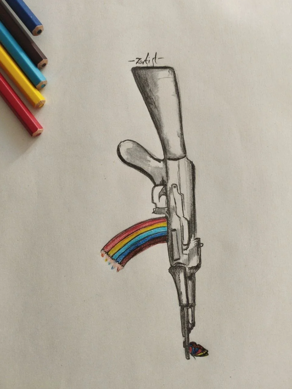 Sketch of a semi-realistic rifle with a rainbow-colored trail coming out of the barrel, labeled as 'artist' at the top.