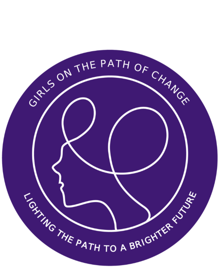 Purple circular logo with a white outline of a girl's face in profile and a flowing line representing her hair. Text around the circle reads 'Girls on the Path of Change' at the top and 'Lighting the Path to a Brighter Future' at the bottom.