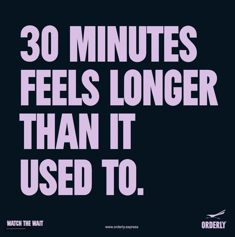 A motivational poster with a dark background and large purple text that reads, "30 MINUTES FEELS LONGER THAN IT USED TO." There is a small logo and website in the bottom right corner, along with the phrase "WATCH THE WAIT" in the bottom left corner.