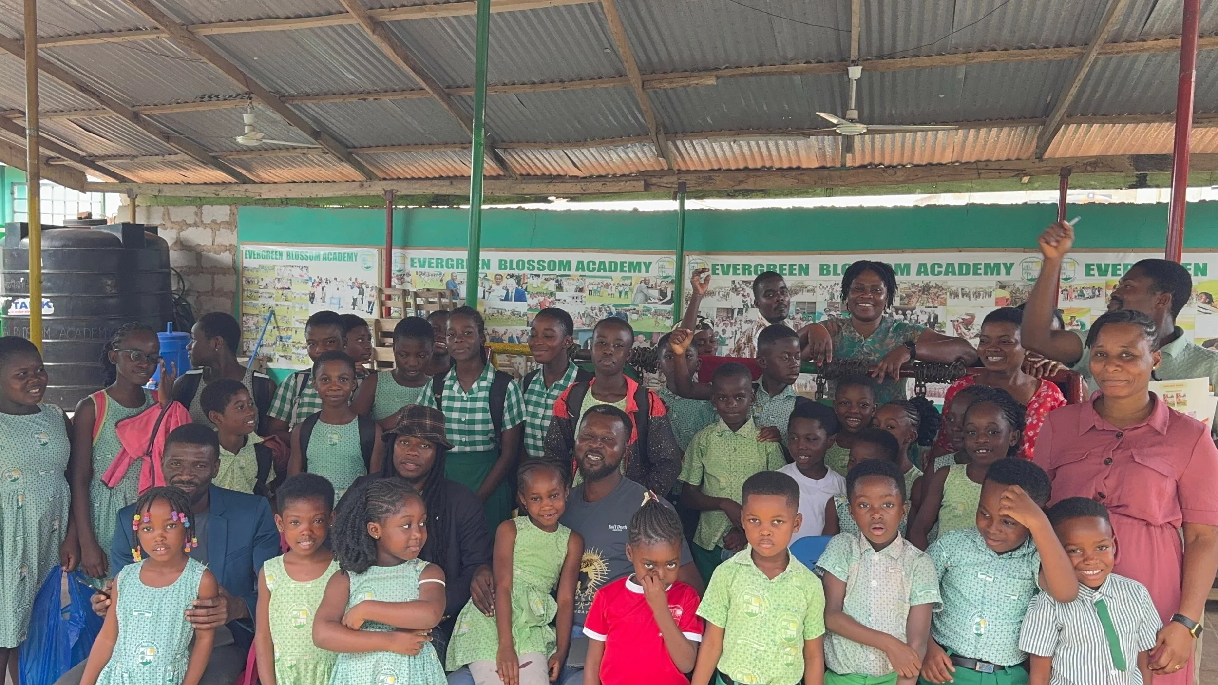 Evergreen students and teachers, along with Ananse Stroke Foundation founder, director and manager.