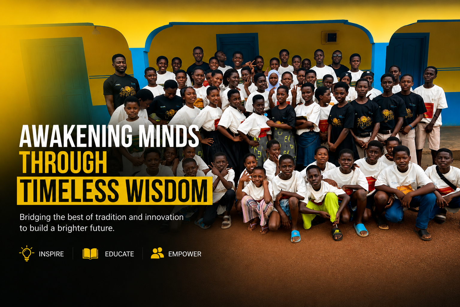 A large group of children and adults smiling and posing outdoors in front of a colorful building. The image contains overlay text that reads, "Awakening Minds Through Timeless Wisdom," along with smaller text, "Bridging the best of tradition and innovation to build a brighter future," and icons with words "Inspire," "Educate," and "Empower."