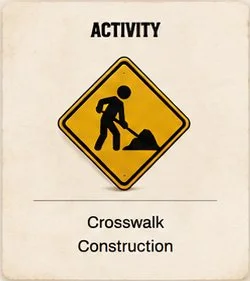 Sign with a pedestrian icon working with a shovel, indicating crosswalk construction.