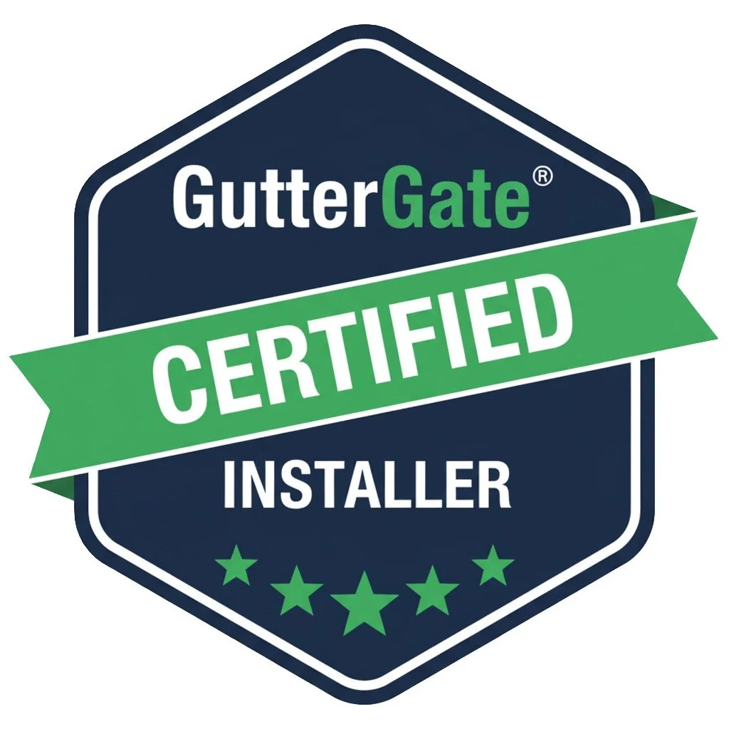 GutterGate certified installer badge with a navy blue hexagonal background, green banner with white text, green stars at the bottom.