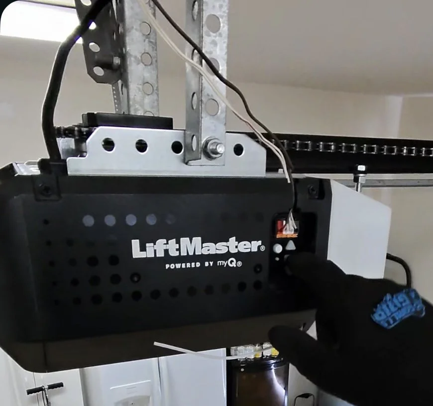 LiftMaster garage door opener professionally installed in a residential garage in West Palm Beach, Florida.