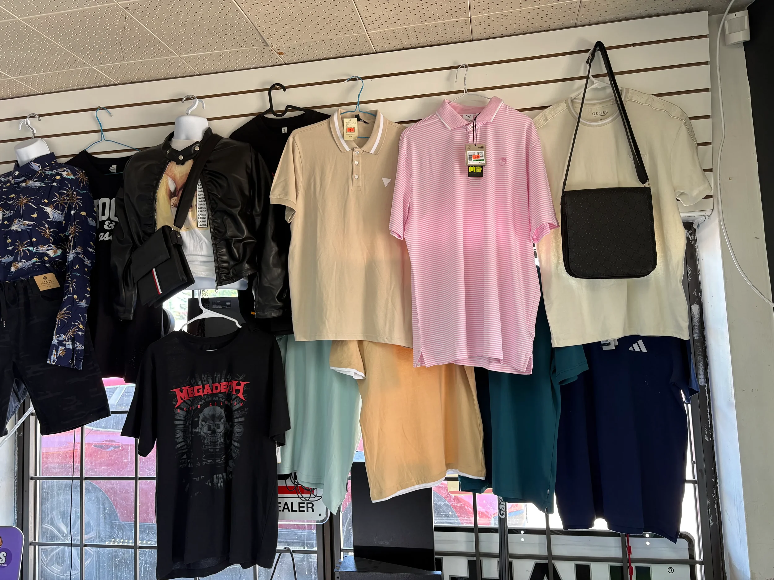 Hanging clothes and apparel selection available at Athlon Food Store.