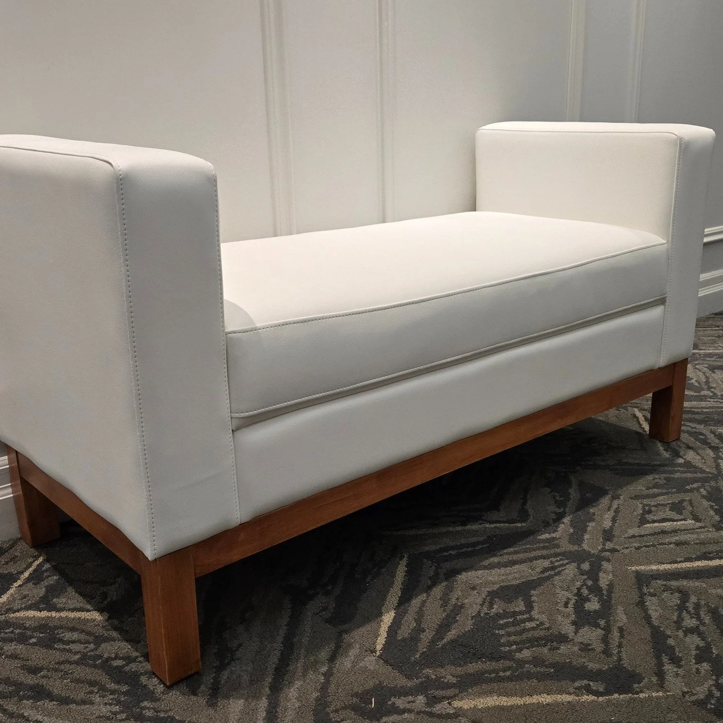 A compact and cute bench for the penthouse elevator lobby! Fire rated for safety in egress areas. Made to last. Part of the Empire Collection