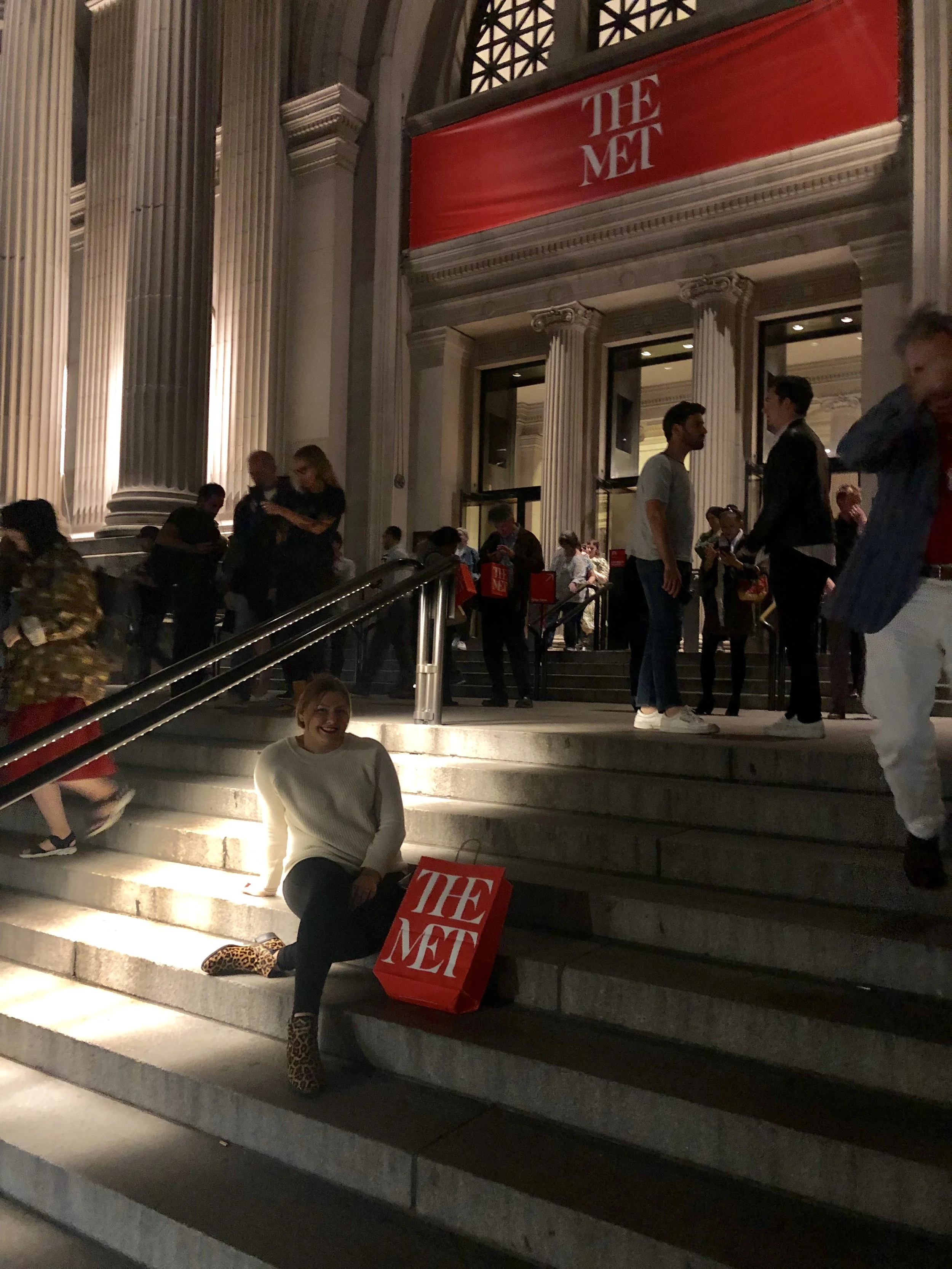 People gathered outside a theater with