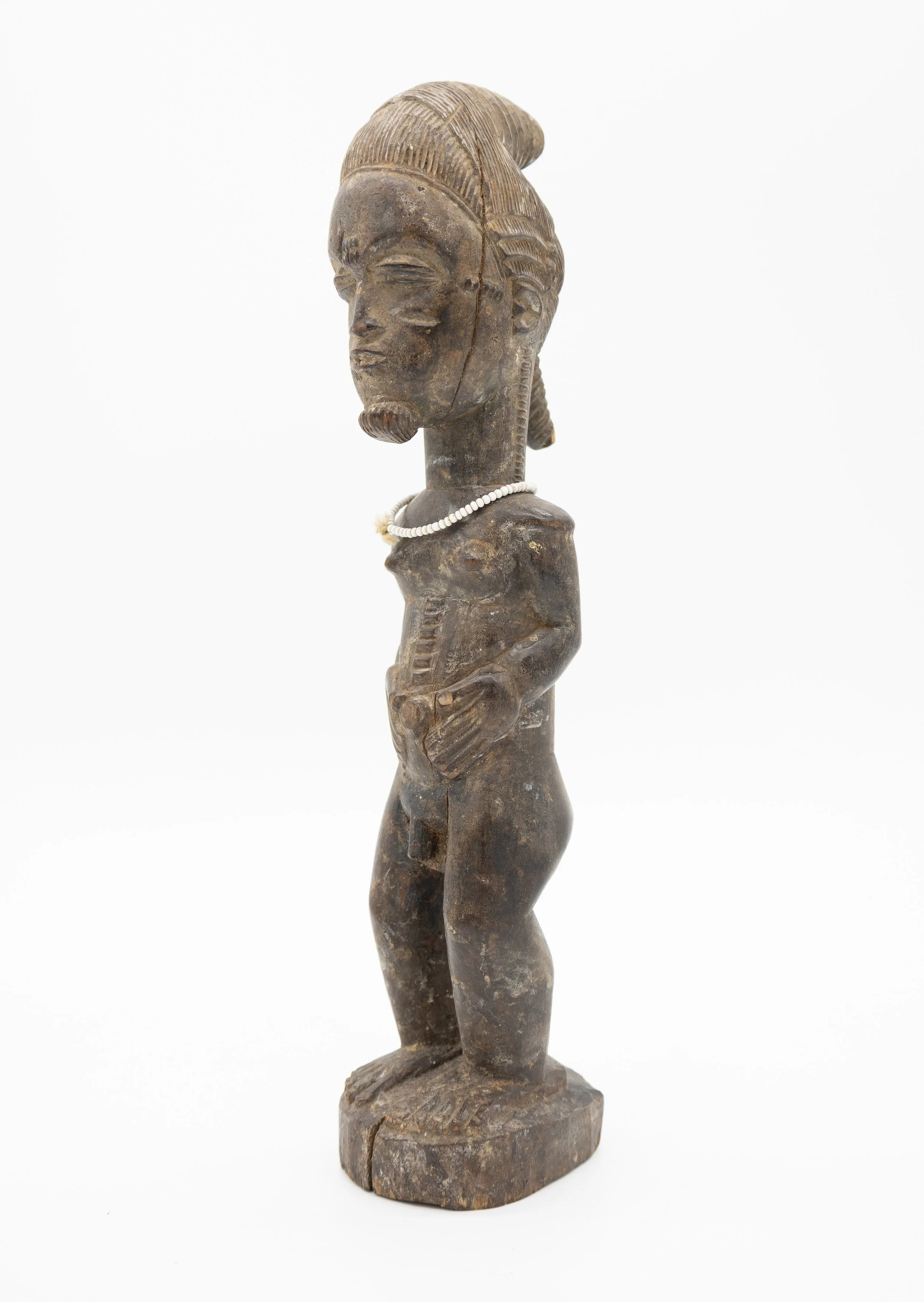West African carved figure with necklace