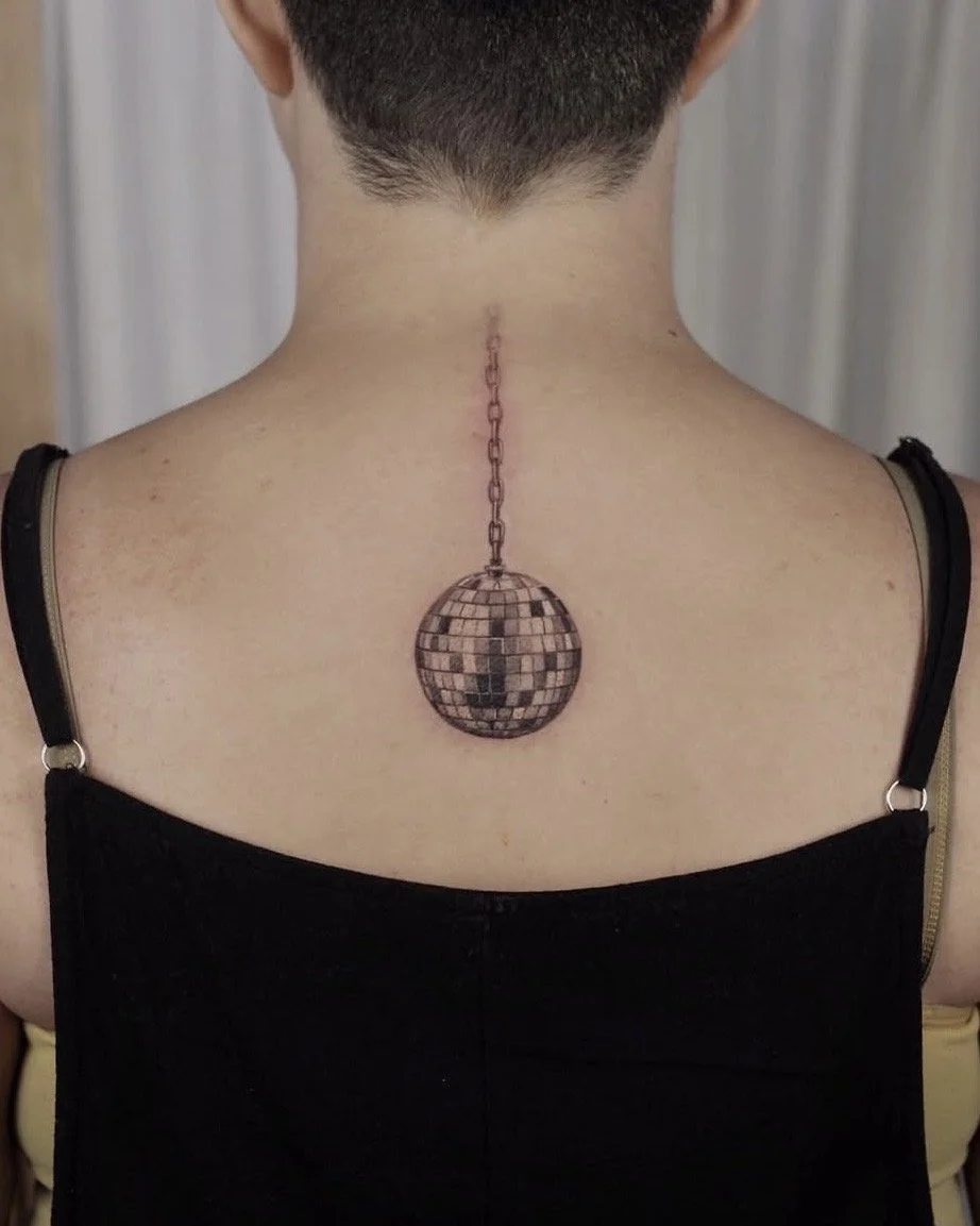2022, first disco ball tattoo