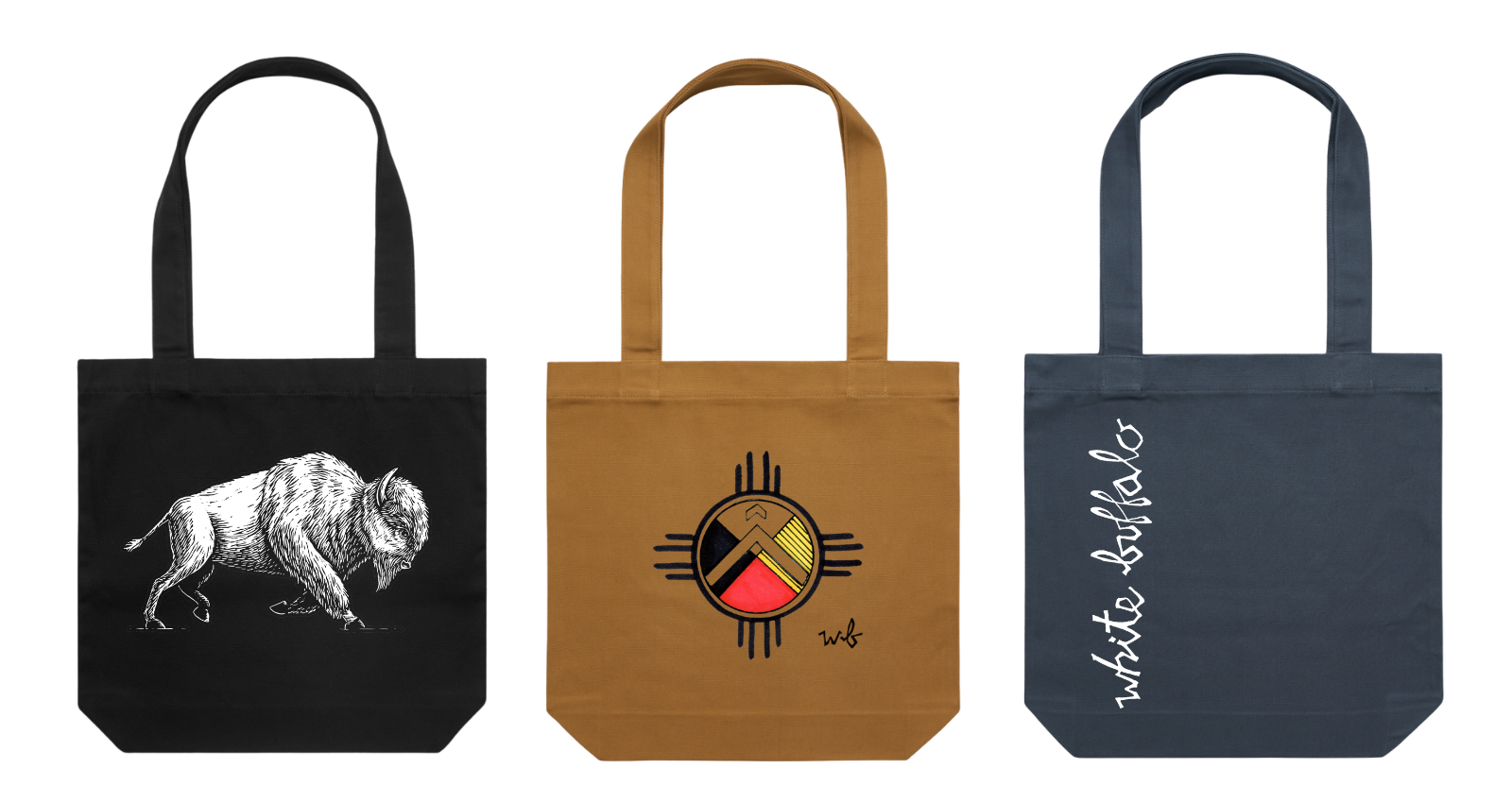 Three tote bags in black, brown, and navy blue, each with different graphic designs, are displayed side by side.