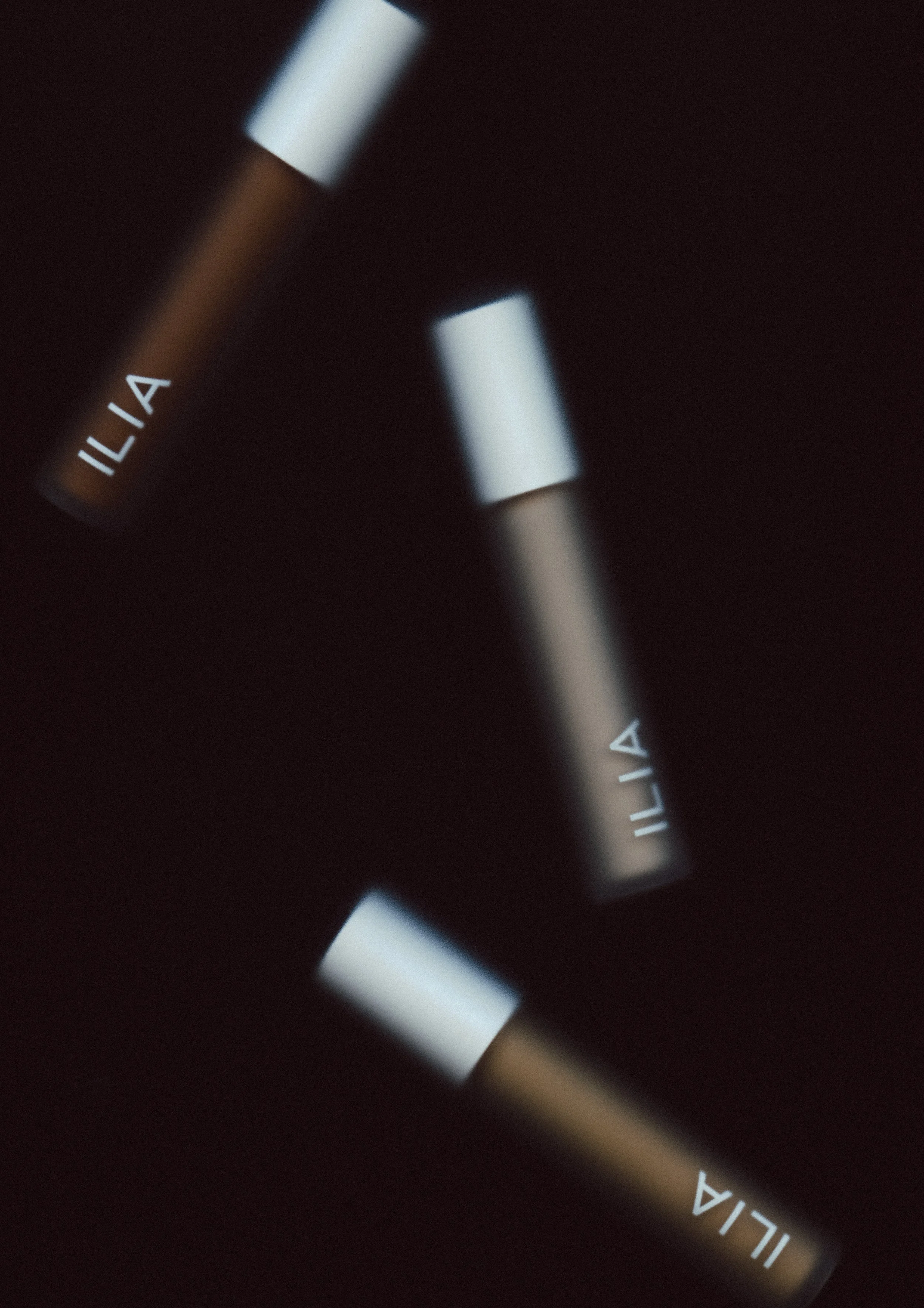 Close-up of a watch face showing the brand name ILIA.