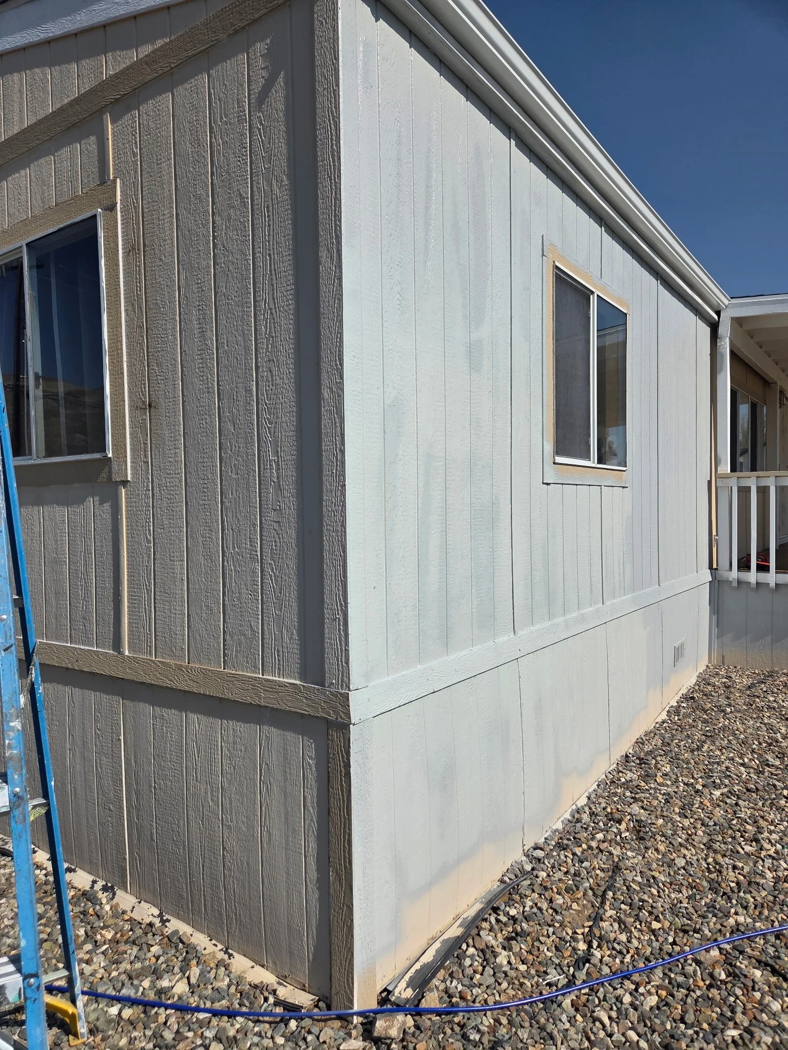 In progress: exterior preparation and first coat of paint