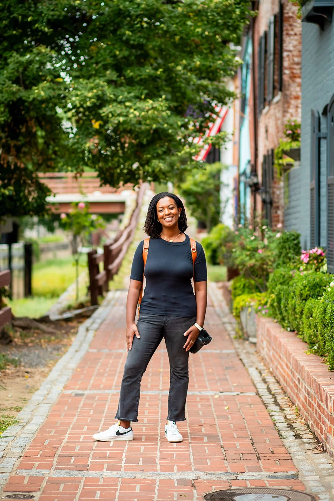 Montgomery County, Maryland documentary photographer standing on a brick pathway.