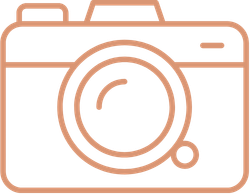 Outline of a camera icon with a large circular lens in the center.