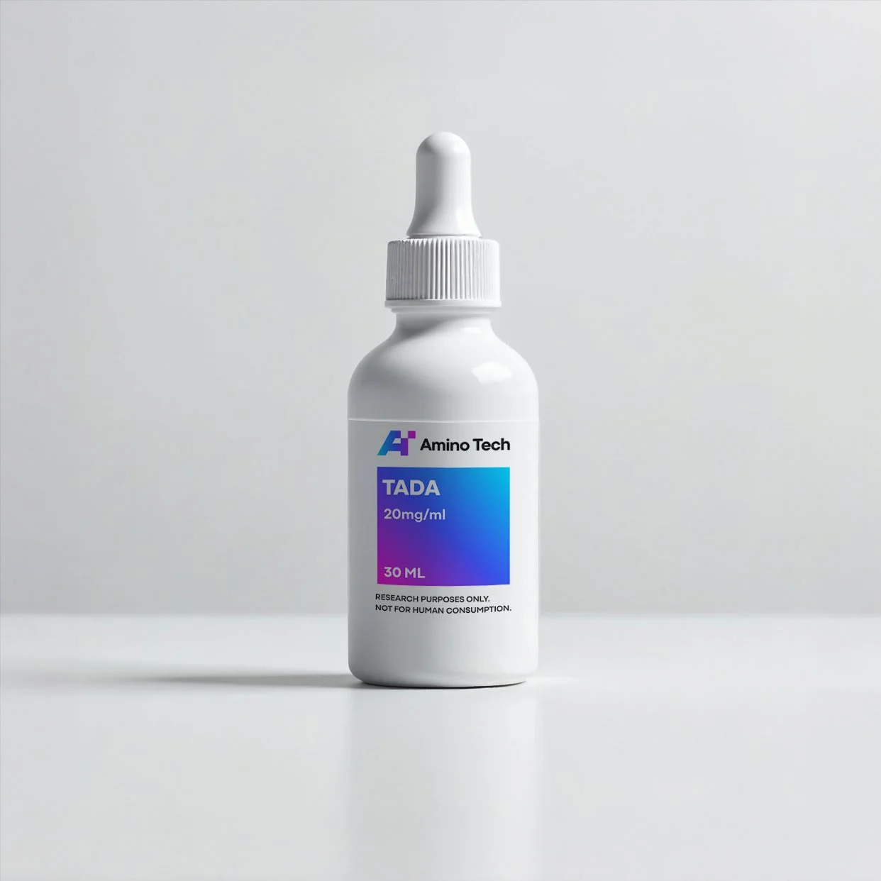 A white bottle with a dropper cap labeled 'Amino Tech TADA 20mg/ml 30 ML' on a white surface against a light gray background, indicating research purposes only.