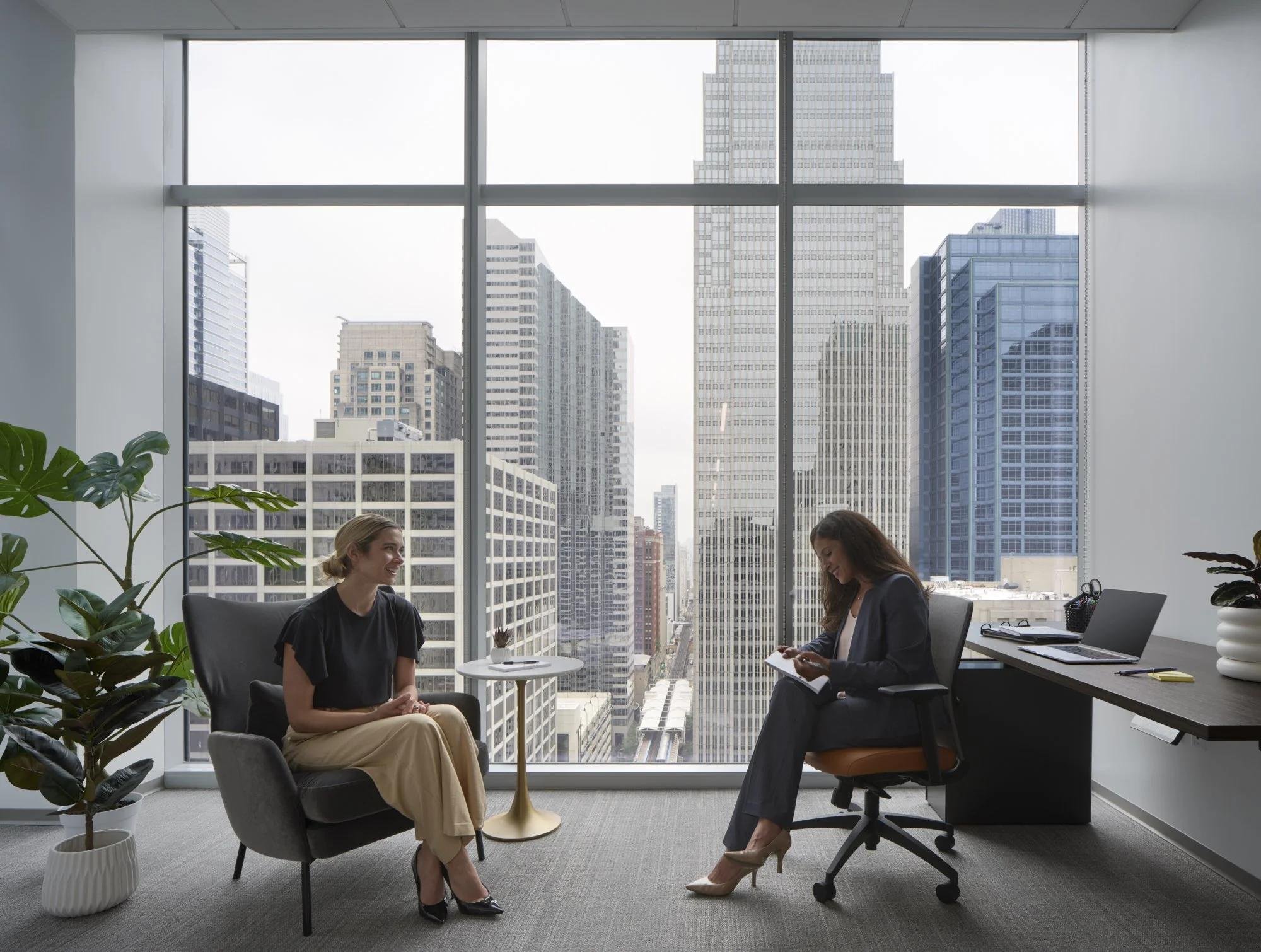 Employment attorney meeting with a business client to discuss workplace legal issues.