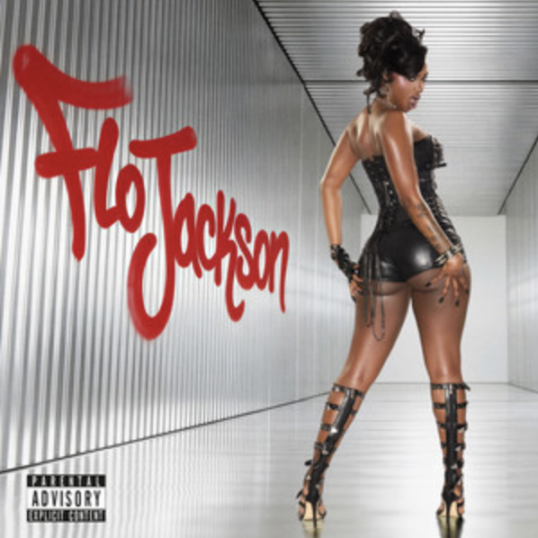 Album cover for Toto Jackson featuring a woman in black leather corset and high-heeled gladiator boots, standing with her back to the camera in a modern, metallic corridor, with the artist's name in red graffiti-style text on the wall.