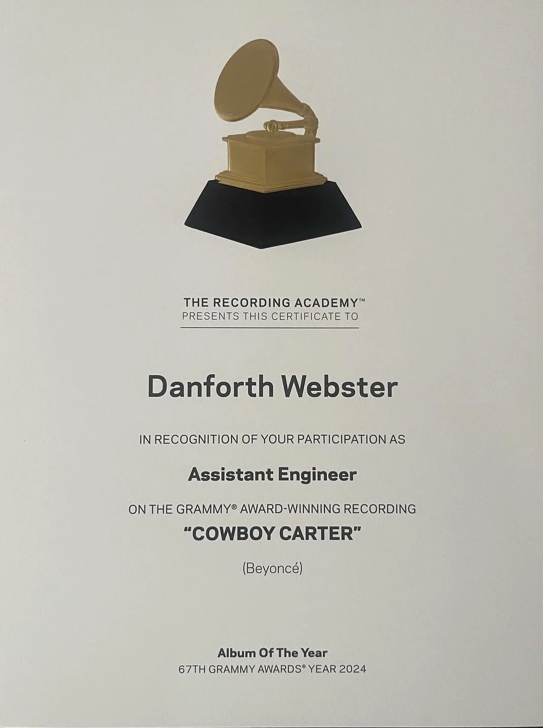 Certificate of participation issued to Danforth Webster for assisting with Beyoncé's Grammy-winning album 'Cowboy Carter' at the 67th Grammy Awards in 2024, featuring a gold gramophone icon at the top.
