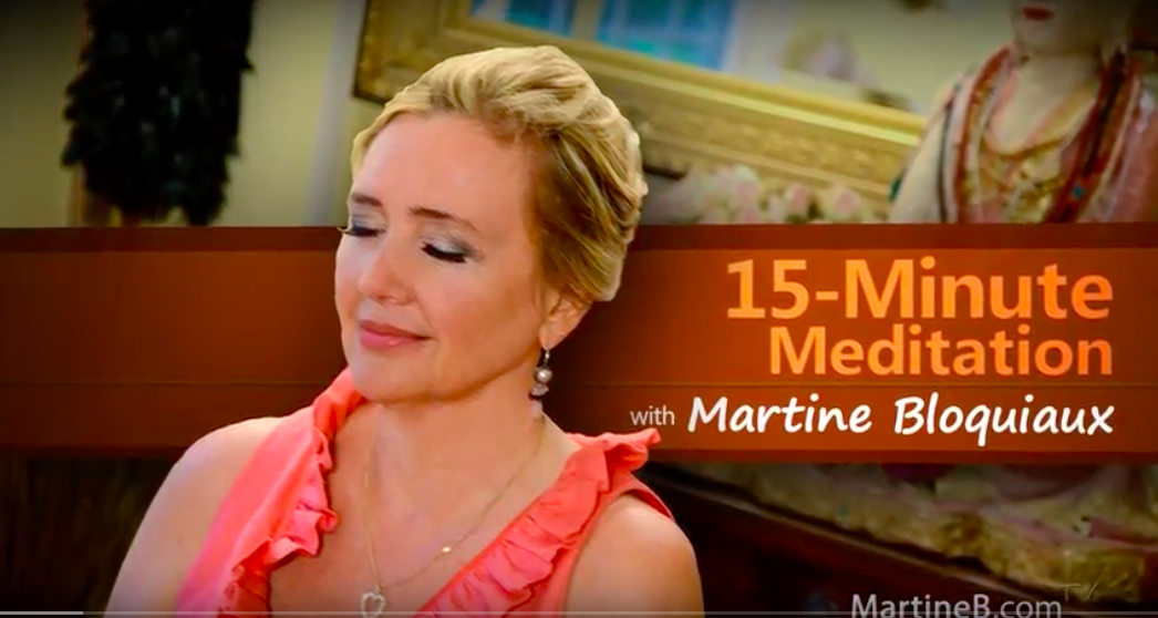 A woman with short blonde hair, wearing a pink ruffled top and earrings, looks peaceful with closed eyes. The background shows a painting and a woman in traditional clothing. Overlay text reads '15-Minute Meditation with Martine Bloquiaux'.