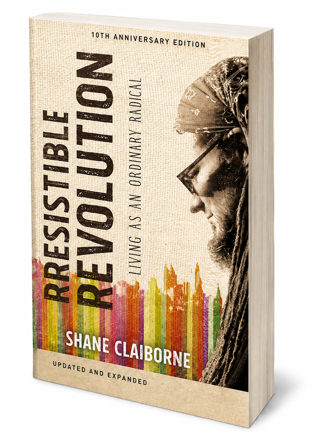 Book cover of 'Rebelution' by Shane Claiborne, celebrating its 10th anniversary edition. The cover features a side profile of a person's face with glasses, with colorful vertical lines at the bottom.