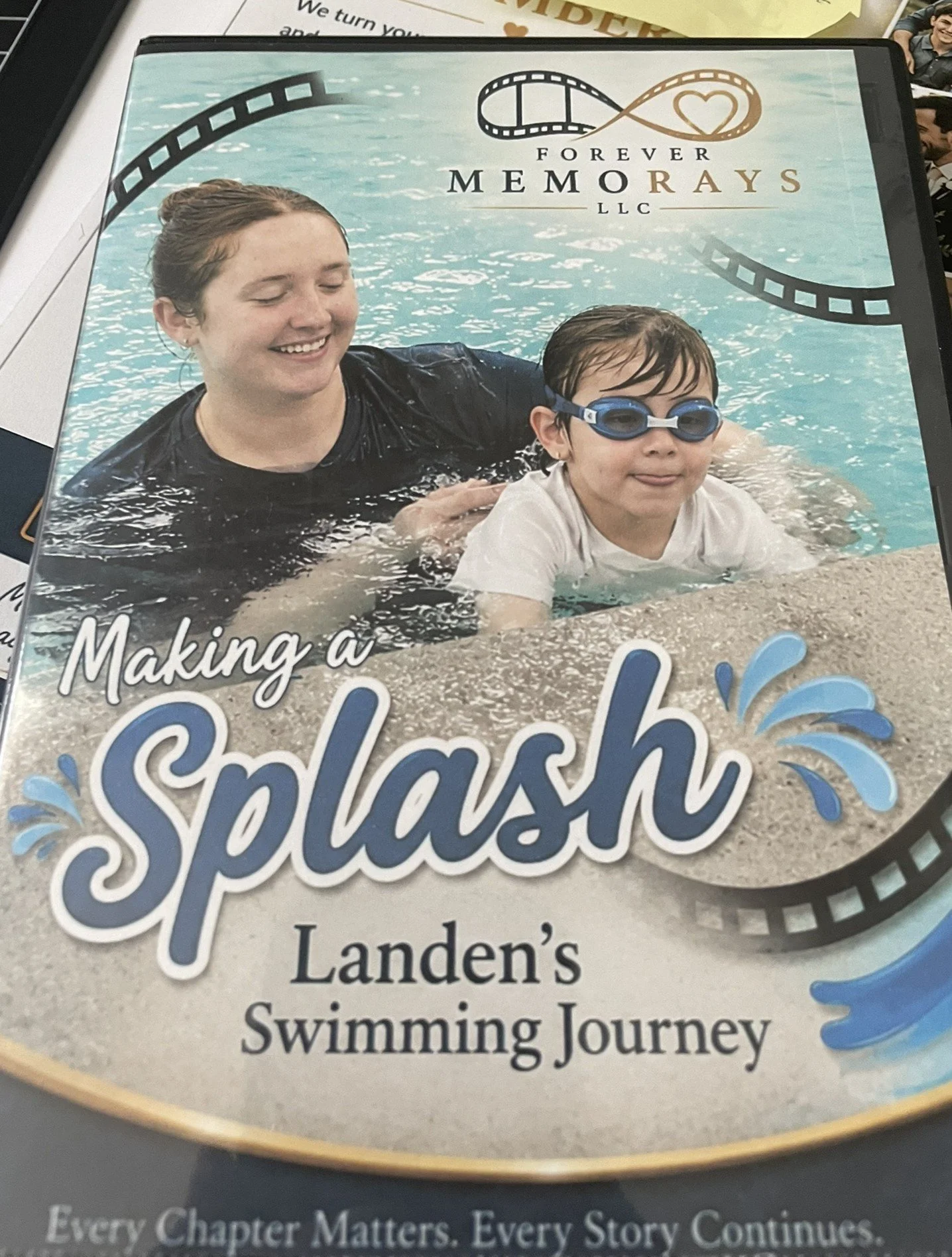 Book cover titled 'Making a Splash: Landen's Swimming Journey' featuring a smiling woman and a boy with goggles in a swimming pool.