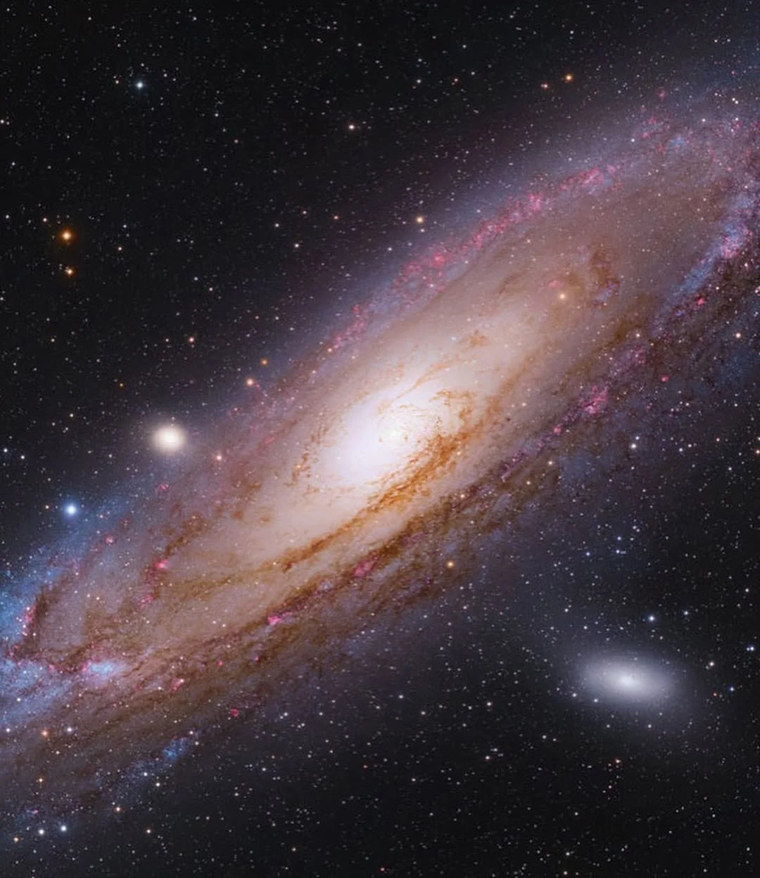 A detailed image of a galaxy with a bright core, spiral arms, and many surrounding stars and galaxies in deep space.