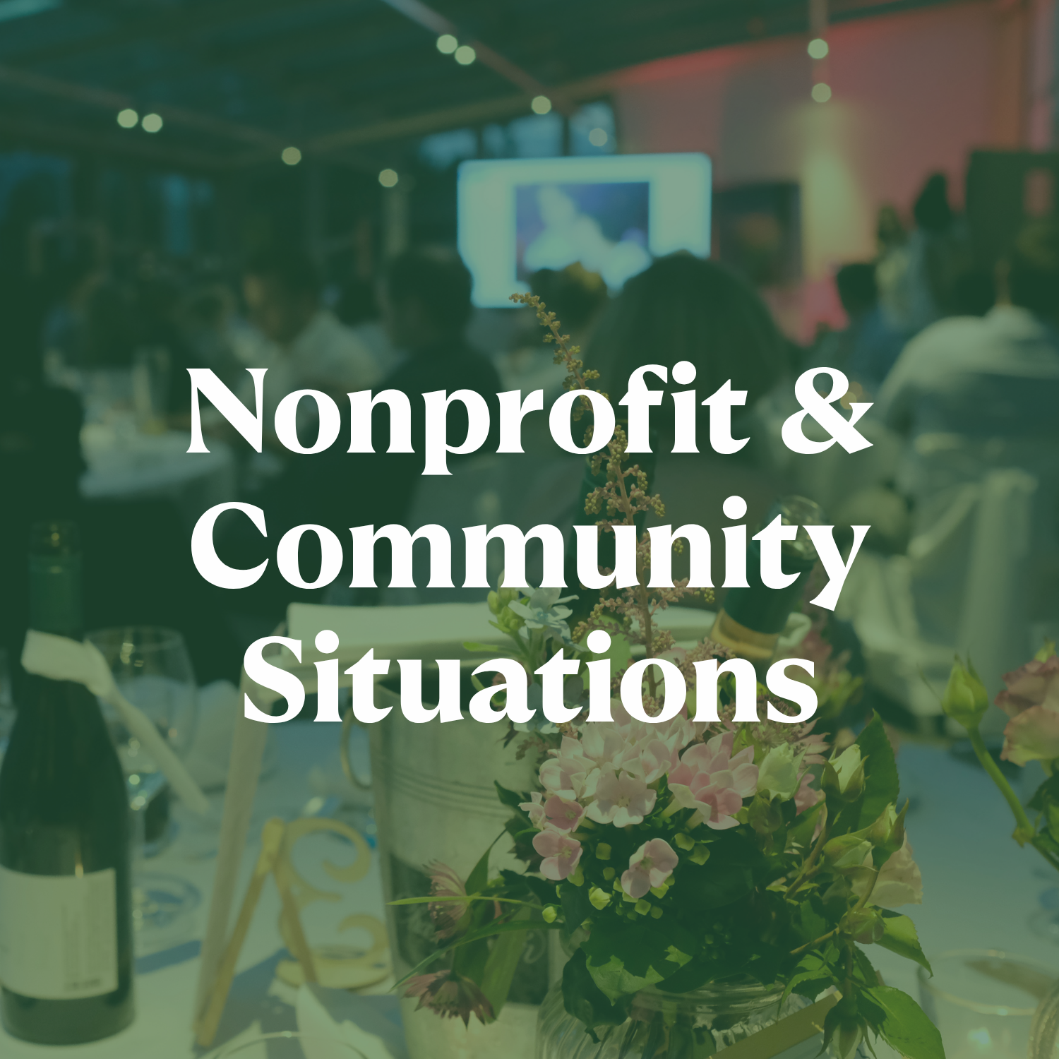 Graphic for Nonprofit & Community Events Button that is showing a nonprofit gathering with people sitting at tables, a large screen in the background, and floral centerpieces on the tables.
